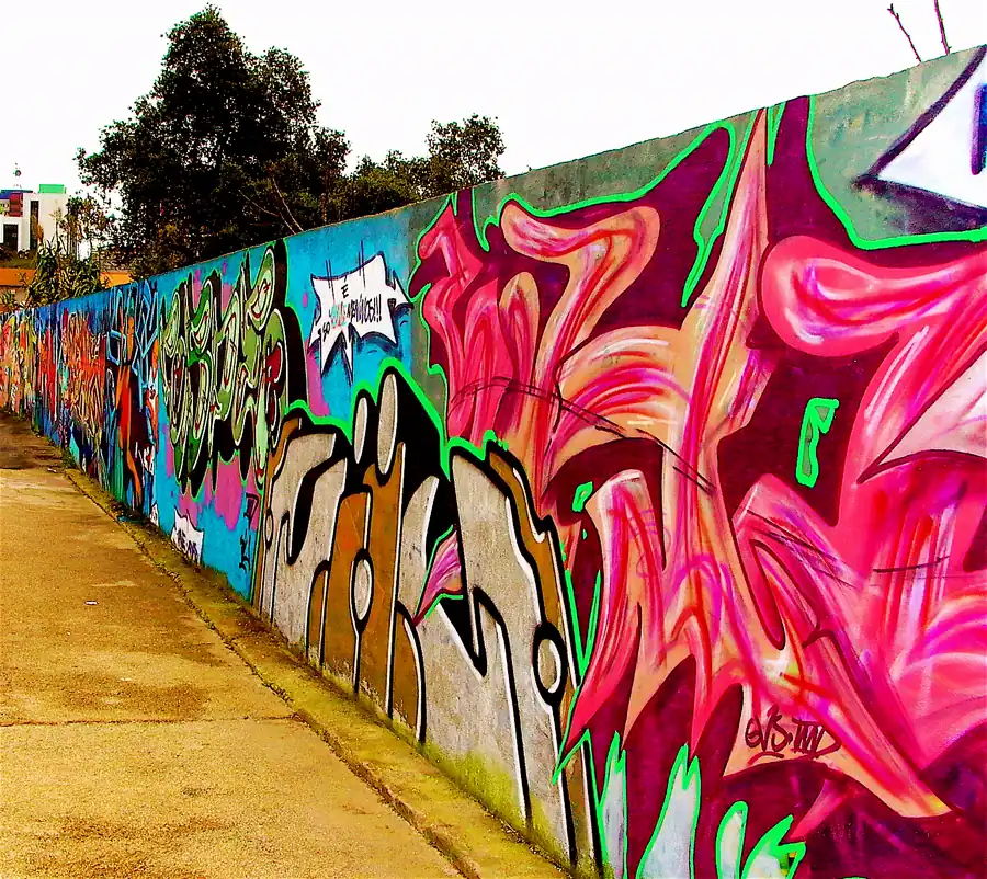 Large outdoor wall covered in a colourful mural